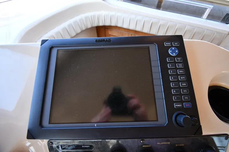 Slide: The Image of Simrad navigation system on 2003 Cruisers Yachts 5000 Sedan Sport dashboard. - 72