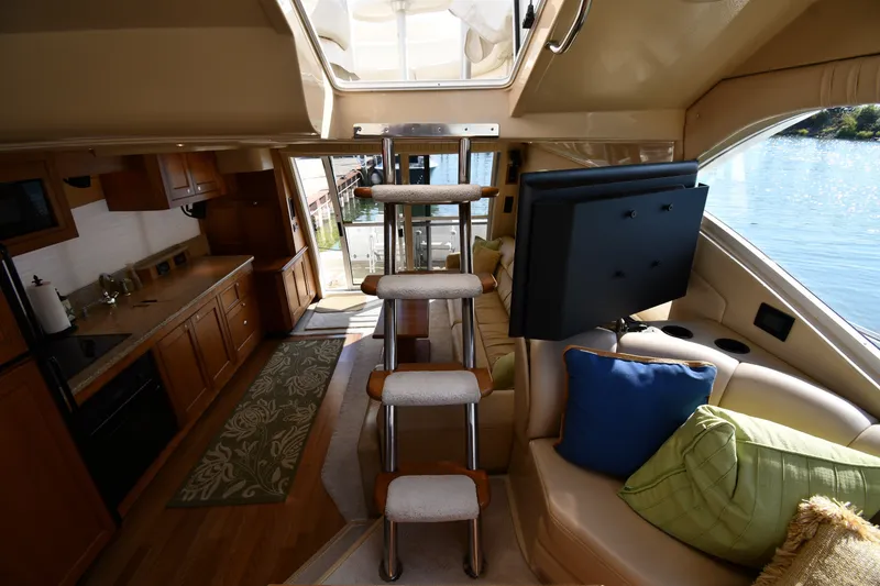 Slide: The Image of Luxurious interior of 2003 Cruisers Yachts 5000 Sedan Sport with modern amenities and scenic water view. - 76