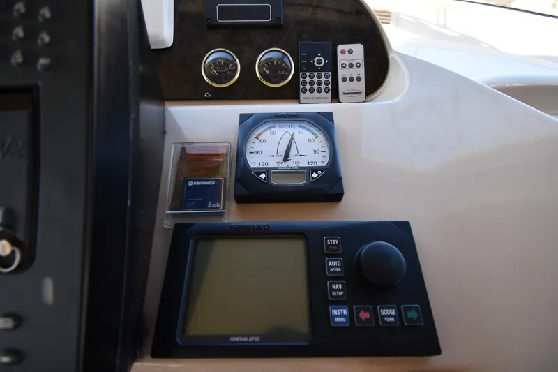 Slide: The Image of Control panel of 2003 Cruisers Yachts 5000 Sedan Sport with navigation instruments. - 73