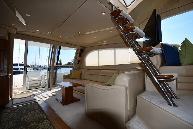 Slide: The Image of Luxurious interior of 2003 Cruisers Yachts 5000 Sedan Sport with elegant seating and marina view. - 60