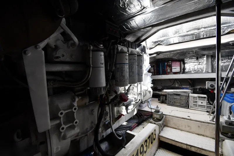 Slide: The Image of Engine room of 2003 Cruisers Yachts 5000 Sedan Sport, showcasing mechanical components. - 84