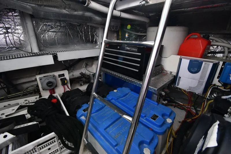 Slide: The Image of Engine room of 2003 Cruisers Yachts 5000 Sedan Sport with tools and equipment. - 88