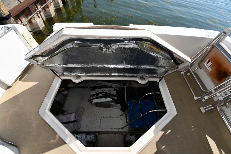 Slide: The Image of Open engine compartment of 2003 Cruisers Yachts 5000 Sedan Sport, dockside view. - 79