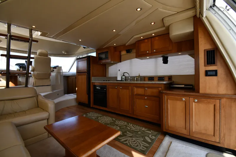 Slide: The Image of Luxurious interior of 2003 Cruisers Yachts 5000 Sedan Sport with modern kitchen amenities. - 58