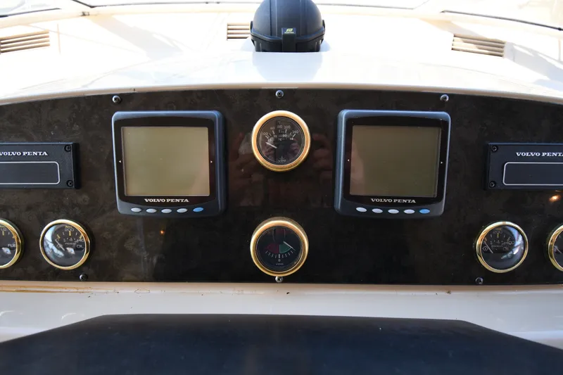 Slide: The Image of Dashboard of 2003 Cruisers Yachts 5000 Sedan Sport with Volvo Penta displays. - 74