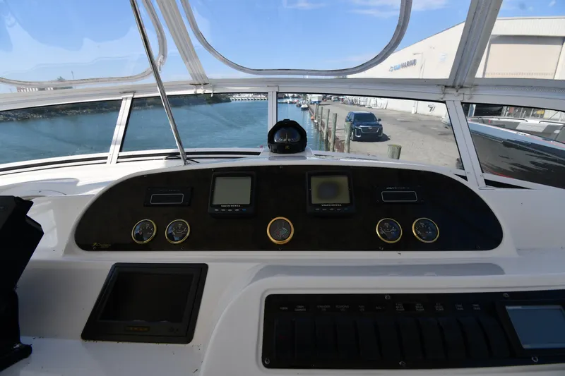 Slide: The Image of Cockpit view of 2003 Cruisers Yachts 5000 Sedan Sport with navigation instruments. - 25