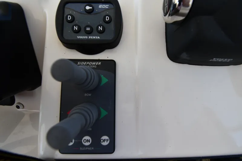 Slide: The Image of Control panel of a 2003 Cruisers Yachts 5000 Sedan Sport with Volvo Penta controls. - 28