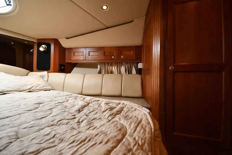 Slide: The Image of Luxurious cabin interior of 2003 Cruisers Yachts 5000 Sedan Sport with wood finish. - 38