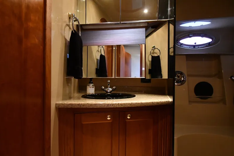 Slide: The Image of Luxurious bathroom interior of 2003 Cruisers Yachts 5000 Sedan Sport with elegant fixtures. - 45