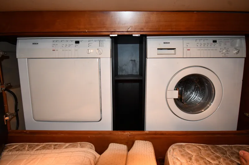 Slide: The Image of Bosch washer and dryer in 2003 Cruisers Yachts 5000 Sedan Sport interior. - 56