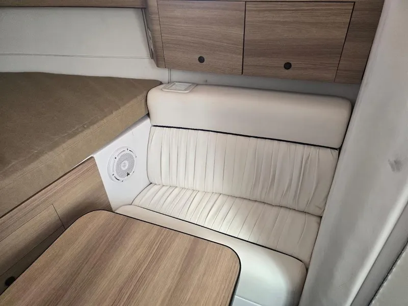 Slide: The Image of Interior of 2008 Donzi 38 ZSF boat with wood cabinets and white seating. - 16