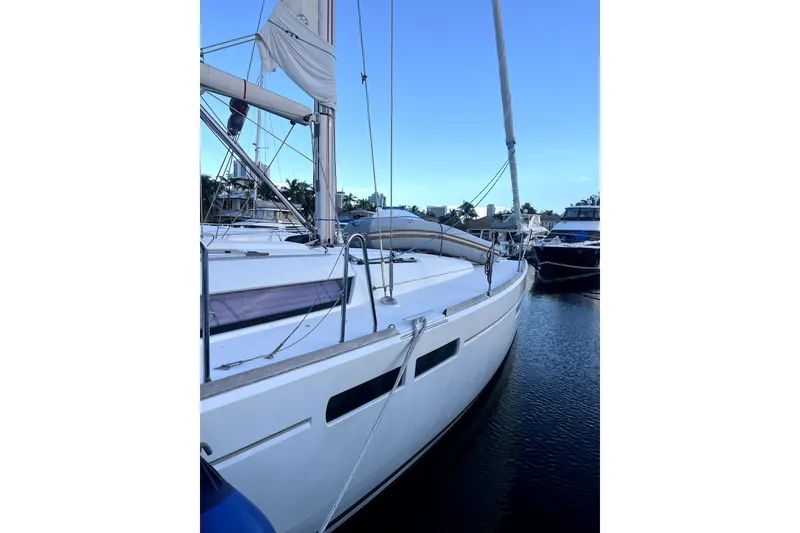 Slide: The Image of 2016 Jeanneau Sun Odyssey 469 sailboat docked in marina, side view. - 22