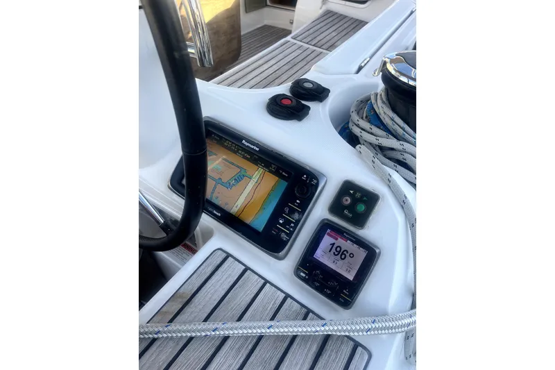 Slide: The Image of Cockpit of 2016 Jeanneau Sun Odyssey 469 with navigation instruments and ropes. - 19
