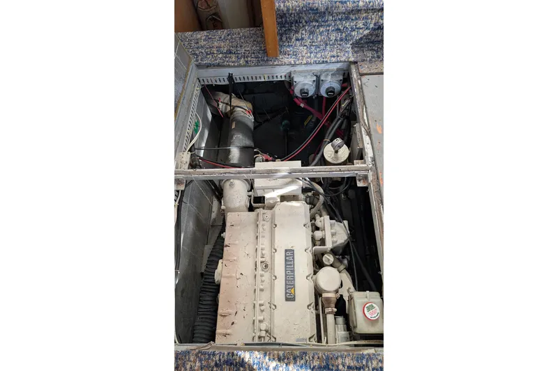 Slide: The Image of Engine compartment of 1994 Carver 370 Aft Cabin Motor Yacht, featuring Caterpillar engine. - 50