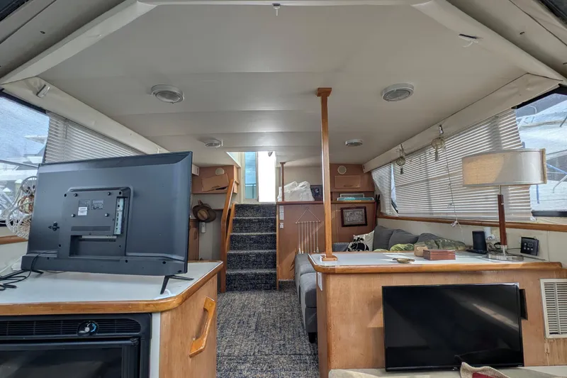 Slide: The Image of Interior of 1994 Carver 370 Aft Cabin Motor Yacht with cozy seating and modern amenities. - 39