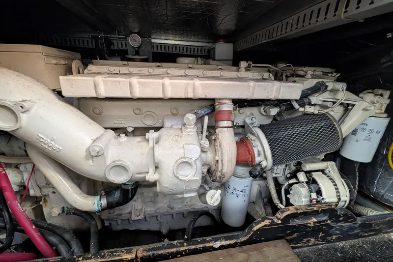 Slide: The Image of Engine compartment of a 1994 Carver 370 Aft Cabin Motor Yacht, showcasing mechanical components. - 57