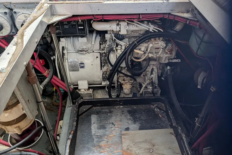 Slide: The Image of Engine compartment of a 1994 Carver 370 Aft Cabin Motor Yacht, showing mechanical components. - 55