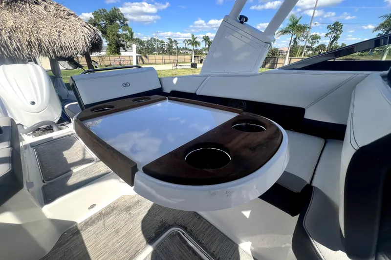 Slide: The Image of Interior of 2022 Cobalt R6 Outboard boat with sleek seating and wooden table. - 35