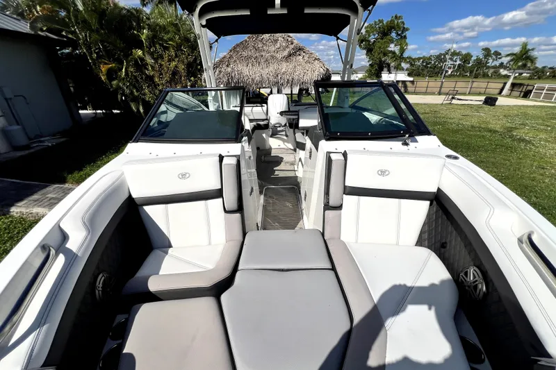 Slide: The Image of 2022 Cobalt R6 Outboard boat interior with white seating and open cockpit. - 44