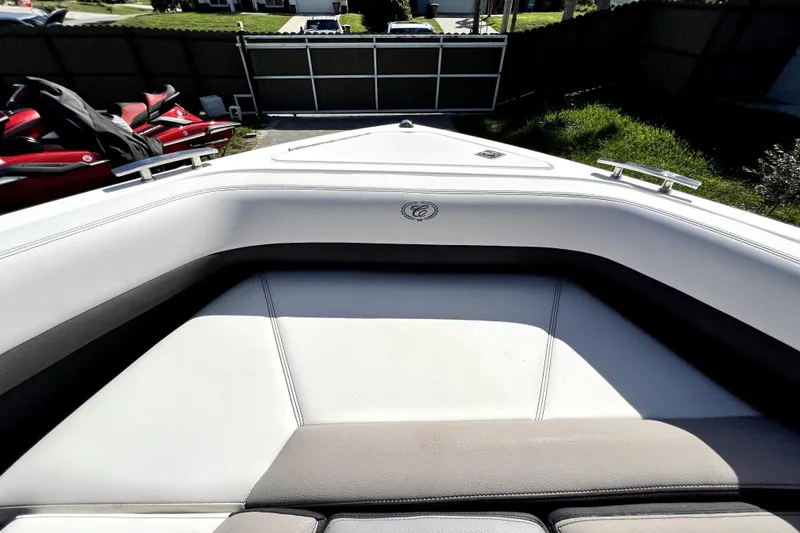 Slide: The Image of 2022 Cobalt R6 Outboard boat interior with white seating and sleek design. - 47