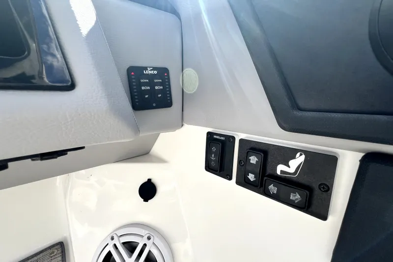 Slide: The Image of Control panel of 2022 Cobalt R6 Outboard boat with Lenco trim tab switches. - 92