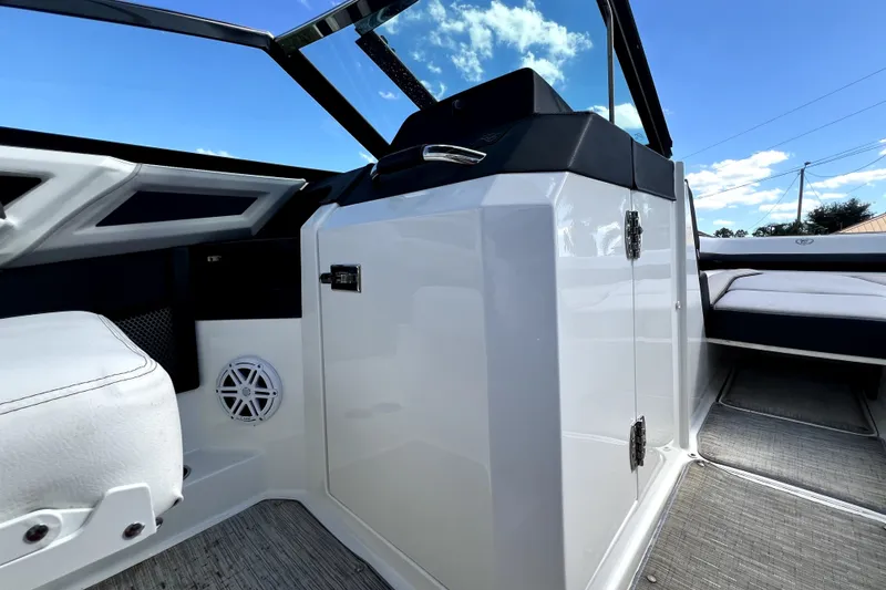 Slide: The Image of 2022 Cobalt R6 Outboard interior, featuring sleek white seating and modern design elements. - 89