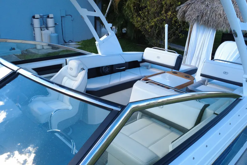 Slide: The Image of 2022 Cobalt R6 Outboard boat interior with luxurious white seating and sleek design. - 30