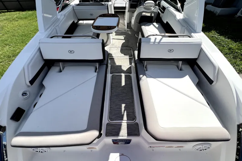 Slide: The Image of 2022 Cobalt R6 Outboard boat interior with white seating and sleek design. - 101