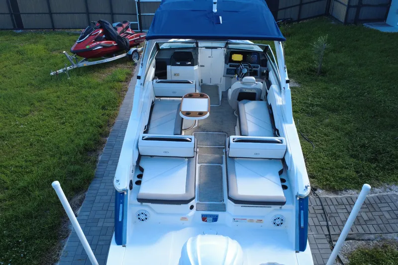 Slide: The Image of 2022 Cobalt R6 Outboard boat with spacious seating and blue canopy. - 28