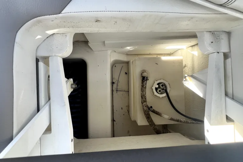Slide: The Image of Interior view of a 2022 Cobalt R6 Outboard boat compartment with visible wiring. - 72