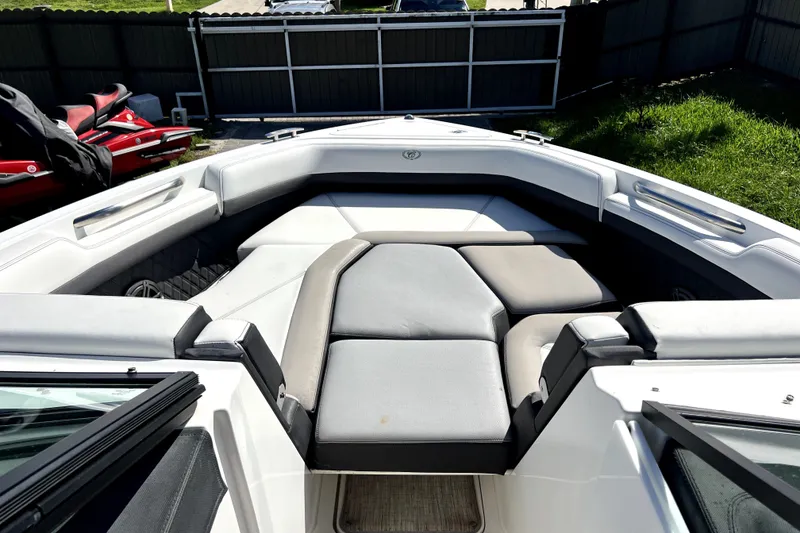 Slide: The Image of 2022 Cobalt R6 Outboard boat interior with cushioned seating and sleek design. - 49