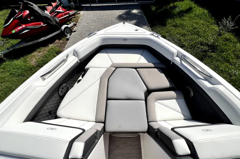 Slide: The Image of 2022 Cobalt R6 Outboard boat interior with cushioned seating and sleek design. - 48