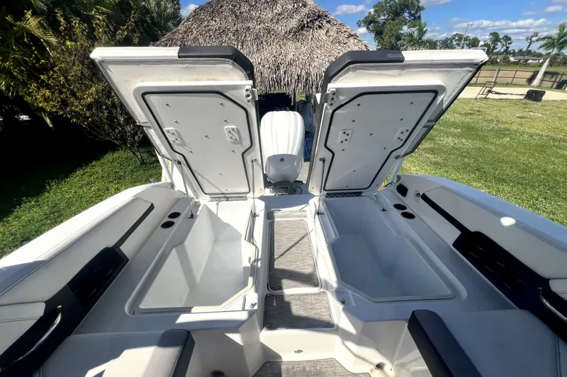 Slide: The Image of 2022 Cobalt R6 Outboard boat with open storage compartments, showcasing spacious design. - 34
