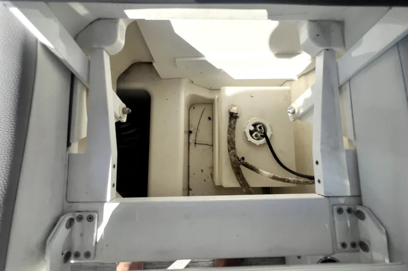 Slide: The Image of 2022 Cobalt R6 Outboard interior compartment with visible wiring and structural components. - 69