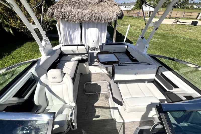 Slide: The Image of 2022 Cobalt R6 Outboard boat interior with plush seating and modern design. - 40