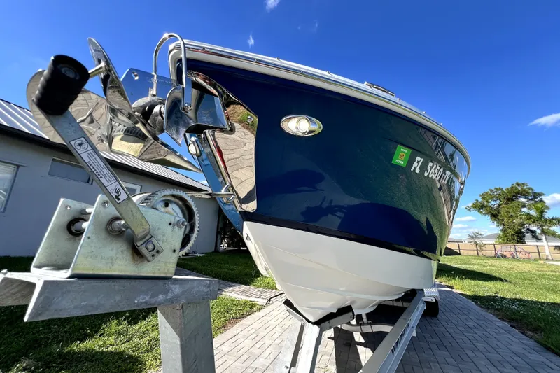 Slide: The Image of 2022 Cobalt R6 Outboard boat on trailer, blue hull, sunny day. - 15