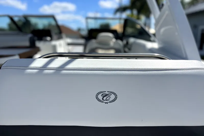 Slide: The Image of 2022 Cobalt R6 Outboard boat interior with white seating and logo detail. - 97