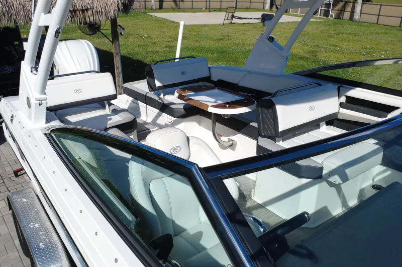 Slide: The Image of 2022 Cobalt R6 Outboard boat interior with white seating and sleek design. - 22
