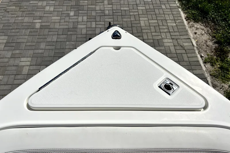 Slide: The Image of Bow of 2022 Cobalt R6 Outboard boat with textured surface and latch. - 45