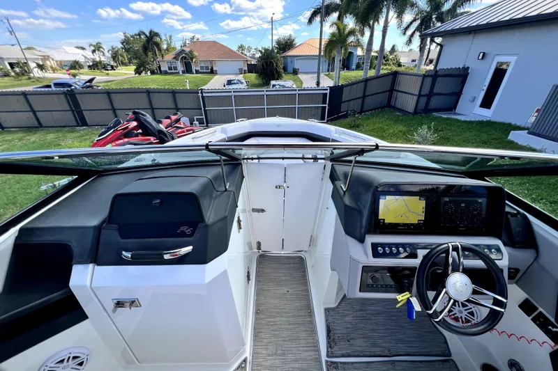 Slide: The Image of 2022 Cobalt R6 Outboard boat cockpit with modern dashboard and steering wheel. - 51