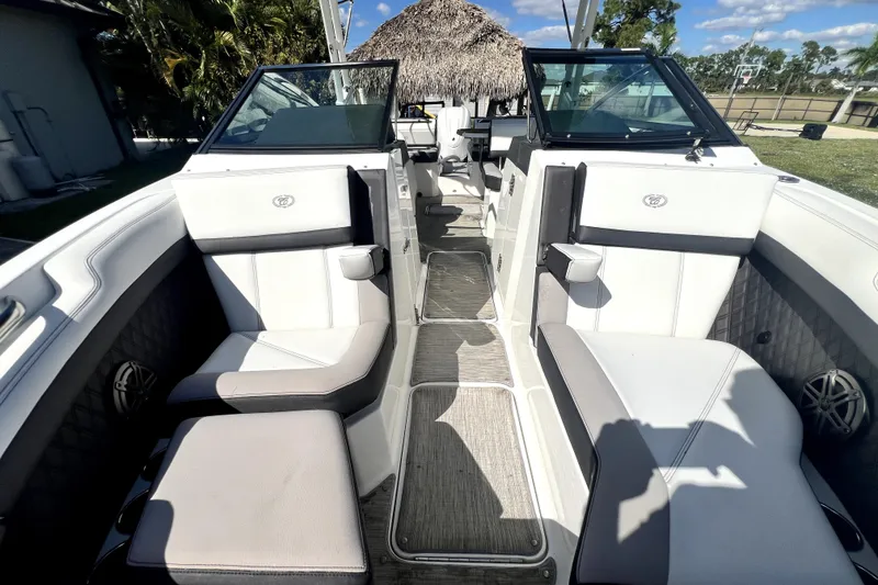 Slide: The Image of 2022 Cobalt R6 Outboard boat interior with white seating and modern design. - 81