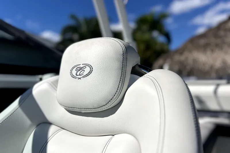 Slide: The Image of Luxurious white leather seat in 2022 Cobalt R6 Outboard boat, featuring embroidered logo. - 67