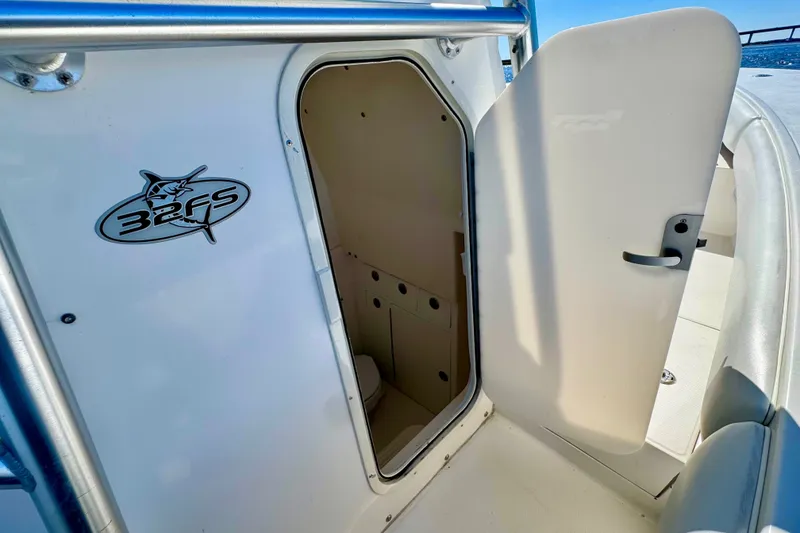Slide: The Image of 2005 Regulator 32 Forward Seating boat cabin entrance with open door. - 28