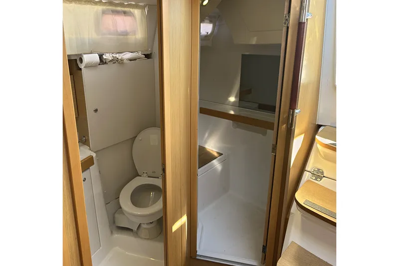 Slide: The Image of Interior view of 2014 Beneteau Oceanis 38 bathroom with toilet and shower area. - 19