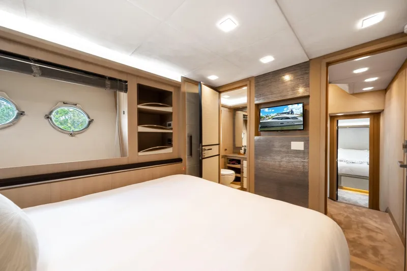 Slide: The Image of Luxurious bedroom interior of 2015 Monte Carlo Yachts MCY 86 with modern amenities. - 68