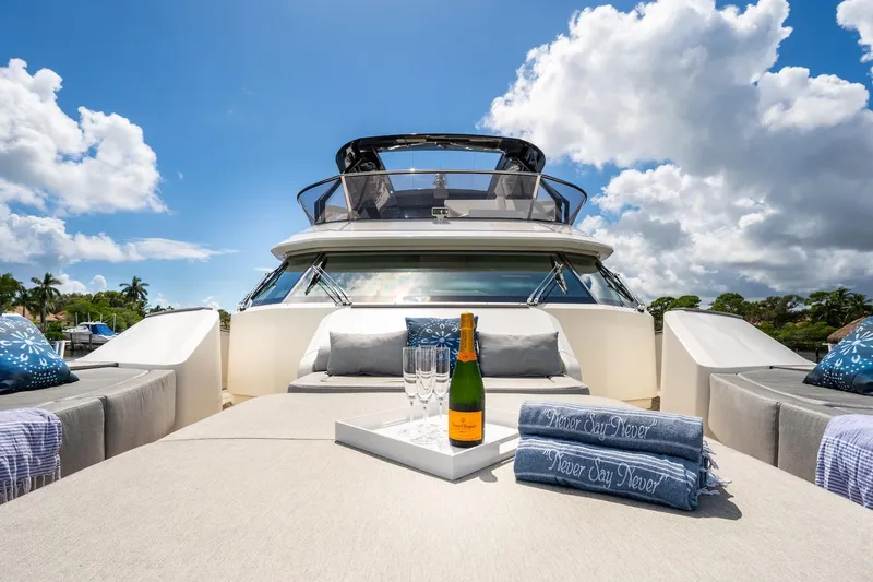 Slide: The Image of Luxurious 2015 Monte Carlo Yachts MCY 86 with champagne on deck under blue skies. - 28