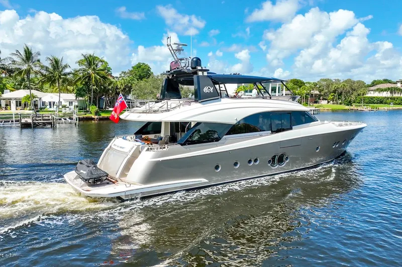 Slide: The Image of Luxury 2015 Monte Carlo Yachts MCY 86 cruising on a scenic waterway. - 22