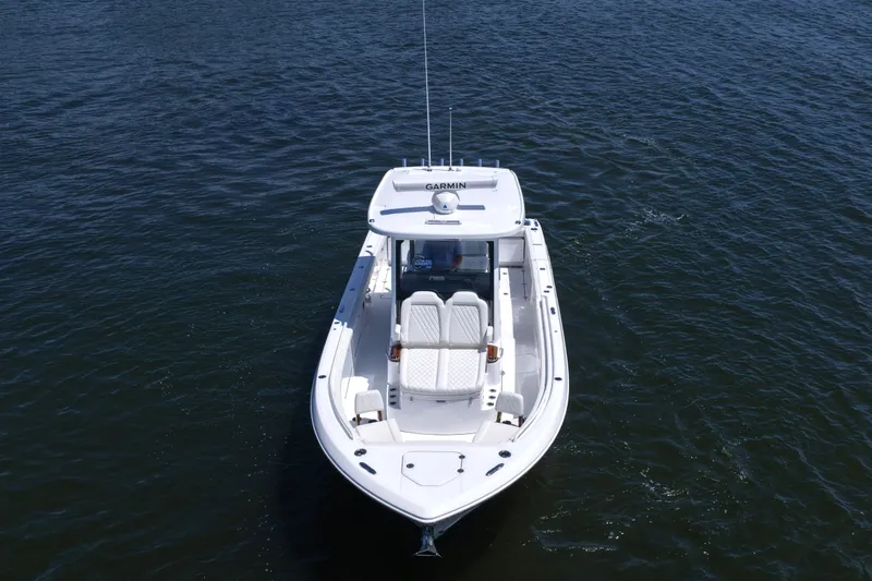 Slide: The Image of 2027 Everglades 315 Center Console boat on open water, aerial view. - 15