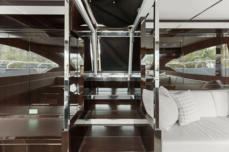 Slide: The Image of Luxurious interior of 2022 Riva 110' Dolcevita yacht with sleek wood and chrome finishes. - 35