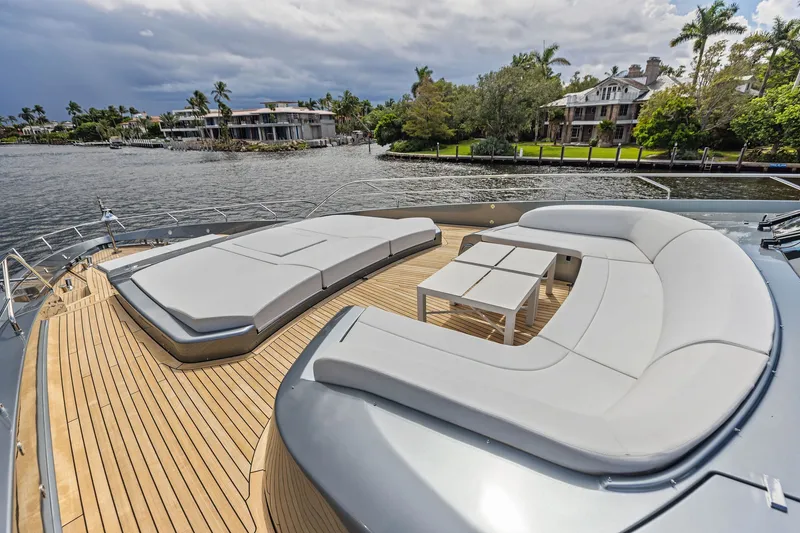 Slide: The Image of Luxurious deck of 2022 Riva 110' Dolcevita yacht with elegant seating and scenic waterfront view. - 10
